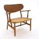 A very beautiful patinated oak armchair by Hans J Wegner CH22. Made by Carl Hansen & Søn, Denmark