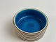 Italian ceramic bowl by Guido Gambone. Clear blue inside. Beige with brown stripes on the outside. Italy in the middle of the 20th century