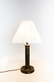 Bordlampe i Diskometal udformet af Just Andersen og nummeret 1B 1862.5000m2 udstilling.