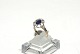 Lady ring with dark blue stones in 14 carat goldSize 58