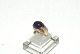 Lady ring with purple stone in 8 carat goldSize 52