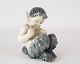 Kgl. porcelæn Panfigur med fløjte, nr.: 1736 af Royal Copenhagen.