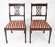 A pair of dining room chairs of mahogany and upholstered red fabric from the 1960s. 5000m2 showroom.