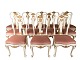 Set of 12 Rococo dining room chairs of white painted wood decorated with leaf gold and upholstered with light pink velvet, from the 1890s.5000m2 showroom.