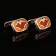 A pair of sterlingsilver and enamel cufflinks by Naja Salto for Georg Jensen. #602. Size: 1,6x2,2cm