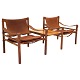 A pair of Arne Norell Scirocco rosewood safari chairs with table. Both chairs with original label. Design Sweden 1964