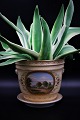 Antique Bing & Grondahl flower pot cover with saucer with fine floral decorations and landscape motif...H:17,5cm. Dia.:21cm.