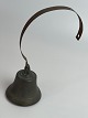 Old shop bell in farmhouse style of patinated metal. 1900s.