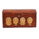 An early 19th century original decorated wooden box with wood cut faces. Denmark circa 1800. H: 14cm. L: 26cm. D: 13cm