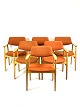 Seks armstole i eg og polstret med orange uldstof designet af Erik Kirkegaard fra 1960erne. 5000m2 udstilling.