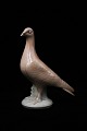 Royal Copenhagen porcelain pigeon.Decoration number: 2930/3510. Height: 20,5cm. Staff sales...