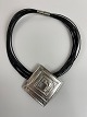 Large pendant in sterling silver / brooch in 14-row leather necklace with clasp made of metal (presumably steel)