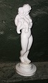 Kai Nielsen: Mother with Child "The Lazy Beast" for the Kähler factory. DEFECT: The figure broken into two parts. Repair at the transition between feet and plinth. Otherwise in good condition. Signed HAK, Danmark and modelnumber on the bottom. H. 31½ cm (12.11 inches).