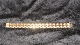 Elegant Armbånd 18 karat guldStemplet  750Længde 18,5 cmBrede 16,20 mmTykkelse 2,57 mm