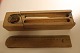 An old pencil box with decorations cut in the wood and flowerdecoration as wellThis is an exampel of how the pencil box was in the good old days