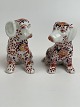 Pair of Japanese Imari porcelain dogs decorated with lotus flowers, vase pattern and foliage