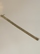 Elegant V pattern in 14 carat gold and white goldStamped 585Length 19.5 cm approxNice and well maintained condition