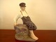 Royal Copenhagen figur, Dreng på sten.Design: Chr. Thomsen 1914 Dek. nr. 1659.