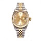 Rolex Oyster Perpetual Datejust G/S ref. 69173. D: 26mm. Champagnefarvet skive m timemarkører i form af diamanter. Leveres med boks og certifikat. Årgang 1996. Leveres nyserviceret
