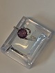 Ladies ring with a brilliant and purple stone 14 carat white goldSize 56