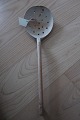Big old perforated ladle made of woodPlease look at the handle too