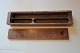 An old pencil box made of woodThis is an exampel of how the pencil box was in the good old daysL: about 23cm