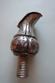 An old pourerIn a untraditionel shape and with very beautiful decorations