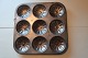 An old baking tin made of metal9 items on one tin