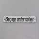 EmaljeskiltBagage under sofaen