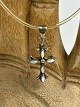 Vintage silver cross with transparent natural rubber "chain" and silver clasp.