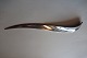A paper knife/paper cutter made of stainless steelRoyal Copenhagen, DenmarkDesign: Allan ScharffL: about 21cmThe paper knife is very good working withIn a good condition