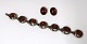 Einar Bernhard Fehrn, Copenhagen. (E F ). Silver bracelet with amber. Length 17.5 cm. A set of ear clips is included.