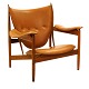 Finn Juhl Høvdingestol. Finn Juhl, 1912-89, Høvdingstol i valnød med cognacfarvet læder. Designet 1949. Fremstillet af OneCollection. Fremstår i flot stand
