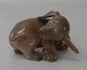 Royal Copenhagen dog figurine 1407 RC Dachshund puppy chasing its tail OM 7 x 11 cm