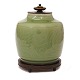 Celadon glazed lidded jar by Georg Thylstrup for Royal Copenhagen #2499. Bronze base and lid by Knud Andersen. Nice condition. H: 22cm