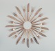 Scandinavian designer. Twelve-person dinner service consisting of twelve dinner knives and twelve dinner forks in handcrafted hammered brass. High-quality craftsmanship.