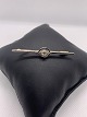 Beautiful brooch in combination of red and white gold, with inlaid brilliant. Extremely elegant.