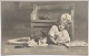 Postcard: Girl with three cats and postcard album in 1913