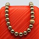 Ole Lynggaard; Clasp in 14k gold with flowers