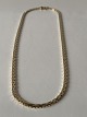 Necklace in 8 carat gold, stamped 333 with 3-rows brick pattern.L: 42 cm.