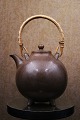 Gunner Nylund ceramic teapot with brown glaze and braided bamboo handle from Rörstrand...