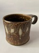Mug, ceramics.Measures 8 x 8 cm.