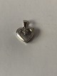 Pendant 14 carat white gold, shaped like a heartwith a diamond