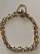 Ole Lynggaard figure-of-eight bracelet in 18 carat gold, with red and white gold clasp.