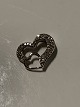 Pendant 14 carat white gold, shaped like a heartwith embedded diamonds.