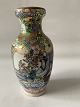 Tall slim Chinese vase in classic style.Height: 15 cm.