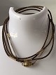 Bracelet in braided horsehair, with clasp and link in 18 carat gold. Very exclusive.