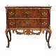 Padouk veneered and partly gilt marble top commode made by the manufacture Köster, Altona, Northgermany, circa 1770. Signed. H: 78cm. Top: 85x44cm
