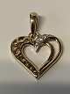 Pendant 14 carat gold, designed as a Heartwith clear stones.