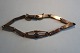 A beautiful and untraditional old bracelet with a link where a blue stone is placedWith a security link (Please see the Photo)Stemplet : NiL: 18cmIn a good condition
